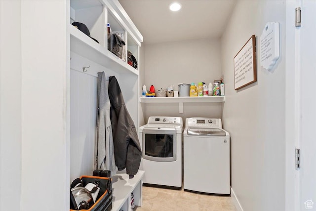 washroom with washer and dryer, recessed lighting, and baseboards