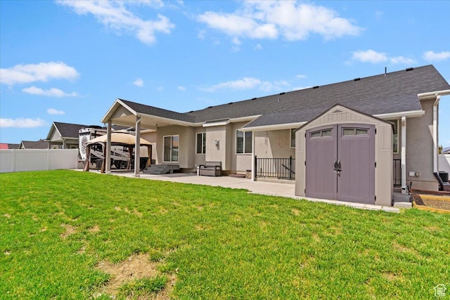back of property with a patio, a gazebo, stucco siding, a storage unit, and an outdoor structure