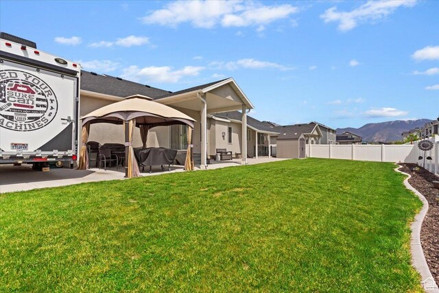 view of yard with a gazebo and a patio area