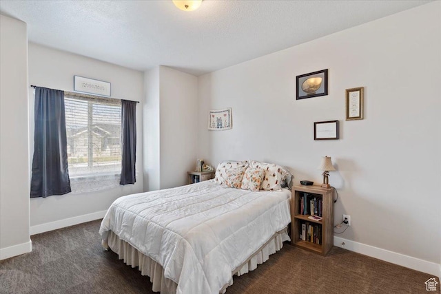 carpeted bedroom featuring baseboards