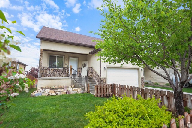 61 N Peach St, Santaquin, UT 84655 - view of front of home featuring an attached garage, stucco siding, covered porch, and stone siding
