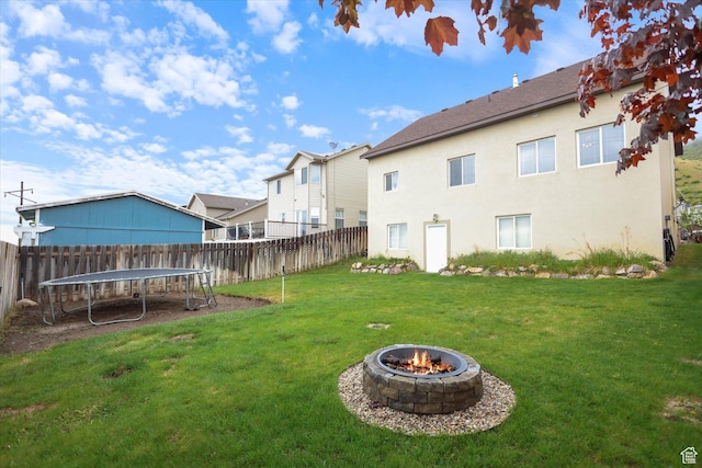 61 N Peach St, Santaquin, UT 84655 - view of yard with a trampoline and a fire pit
