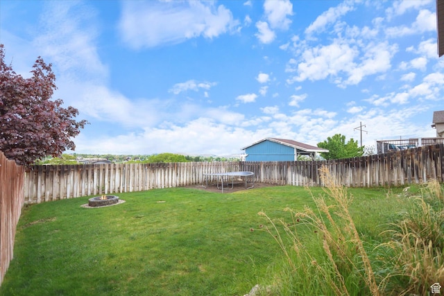 61 N Peach St, Santaquin, UT 84655 - view of yard with a fire pit and a trampoline