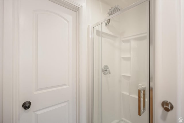 bathroom with a shower stall