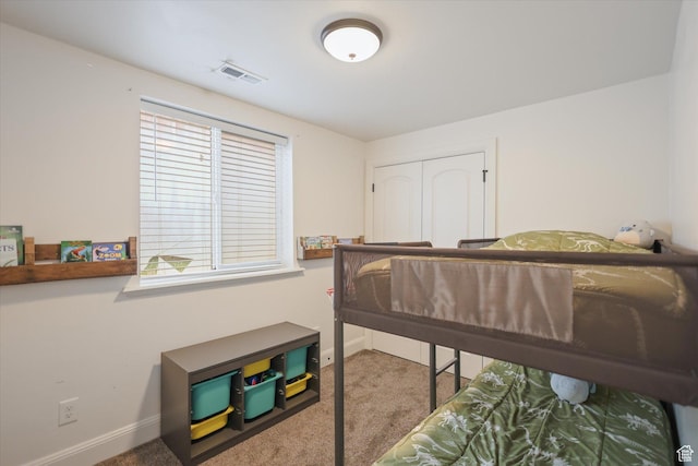 carpeted bedroom with baseboards