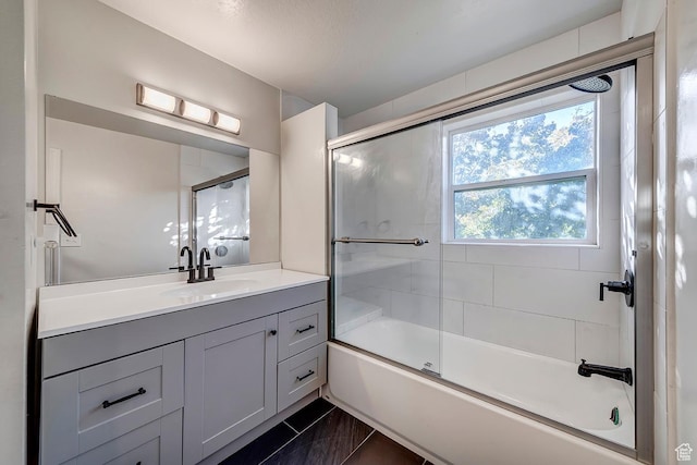 full bath featuring vanity and enclosed tub / shower combo