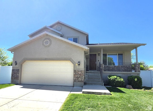 1501 W 2060 S, Woods Cross, UT 84087 - view of front of property with stone siding, a garage, stucco siding, covered porch, and driveway