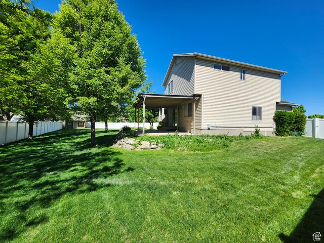 1501 W 2060 S, Woods Cross, UT 84087 - rear view of house featuring a patio