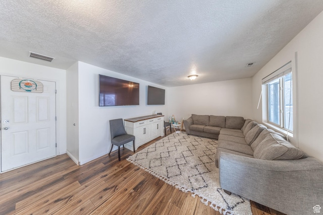 1501 W 2060 S, Woods Cross, UT 84087 - living area with wood finished floors, a textured ceiling, and baseboards
