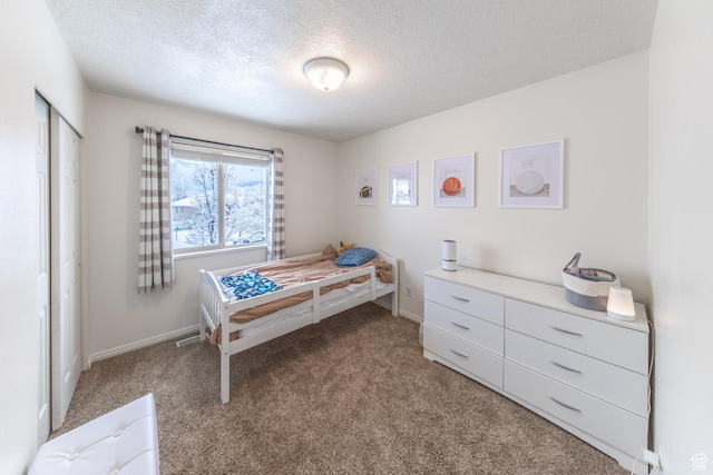 1501 W 2060 S, Woods Cross, UT 84087 - carpeted bedroom featuring a textured ceiling and baseboards