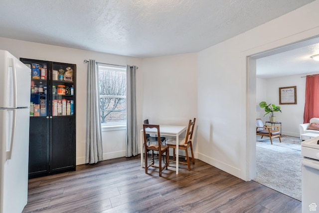 358 W 400 S, Provo, UT 84601 - dining area featuring wood finished floors, baseboards, and a textured ceiling