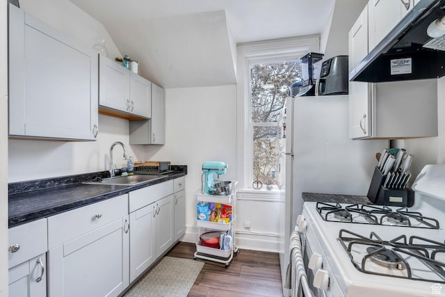 358 W 400 S, Provo, UT 84601 - kitchen featuring a sink, gas range gas stove, dark countertops, dark wood-style flooring, and under cabinet range hood