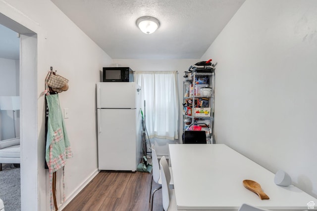 358 W 400 S, Provo, UT 84601 - laundry area with wood finished floors, a textured ceiling, and baseboards
