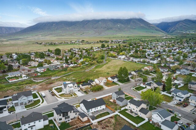 677 E 700 N, Tooele, UT 84074 - aerial perspective of suburban area featuring a mountainous background