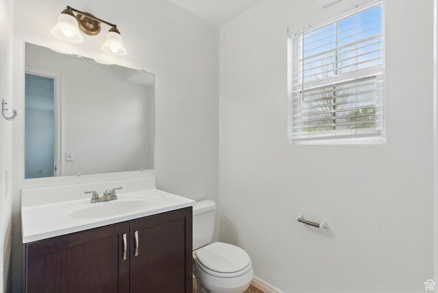 677 E 700 N, Tooele, UT 84074 - bathroom featuring vanity, toilet, and baseboards