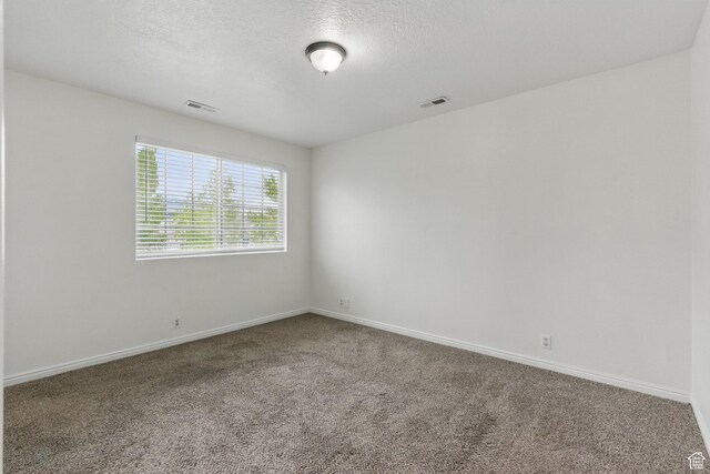 677 E 700 N, Tooele, UT 84074 - carpeted spare room featuring baseboards and a textured ceiling