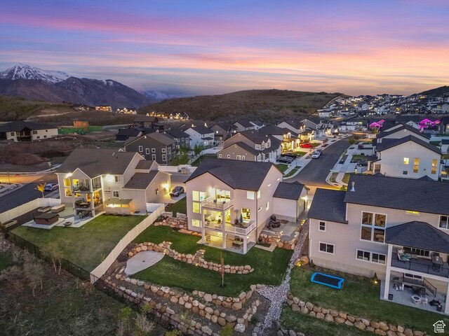 aerial view of residential area featuring mountains