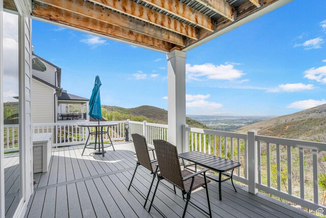 wooden terrace with a mountain view