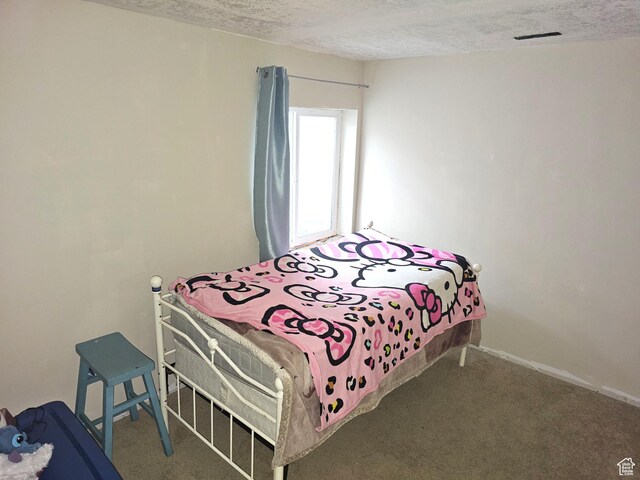 1771 E Skyline Dr Unit I4, Eagle Mountain, UT 84005 - bedroom with a textured ceiling and carpet flooring