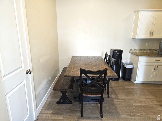 1771 E Skyline Dr Unit I4, Eagle Mountain, UT 84005 - dining area with dark wood-type flooring and baseboards