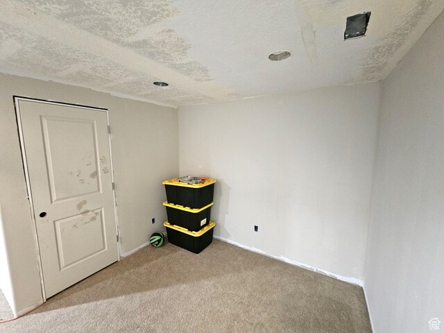 1771 E Skyline Dr Unit I4, Eagle Mountain, UT 84005 - unfurnished room with carpet, baseboards, and a textured ceiling