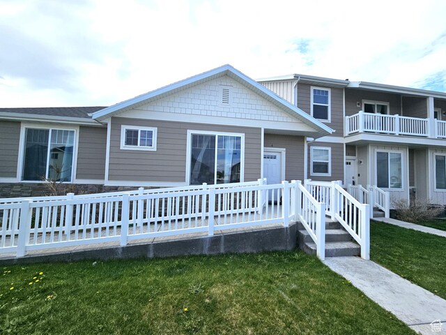 1771 E Skyline Dr Unit I4, Eagle Mountain, UT 84005 - view of front of house featuring a front lawn