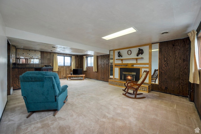 825 W Arapahoe Ave S, Salt Lake City, UT 84104 - living area with wooden walls, a glass covered fireplace, and light colored carpet