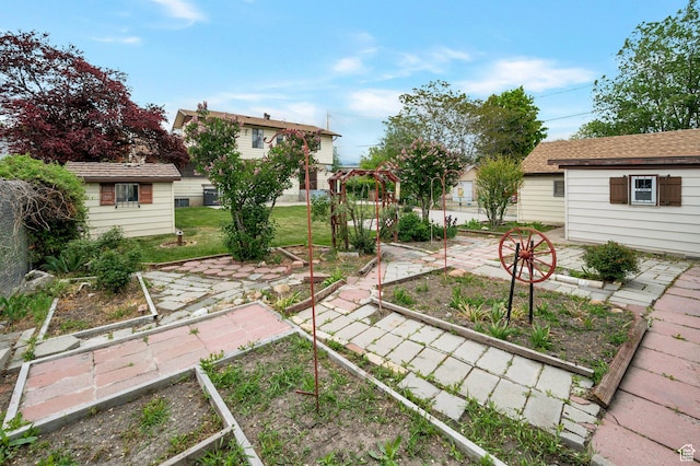 825 W Arapahoe Ave S, Salt Lake City, UT 84104 - view of green lawn featuring a garden and an outdoor structure