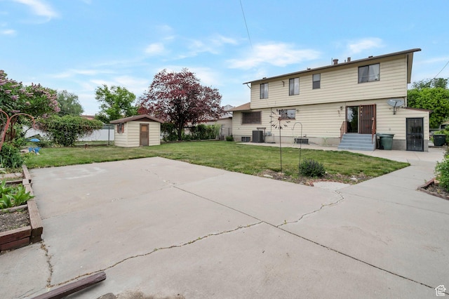 825 W Arapahoe Ave S, Salt Lake City, UT 84104 - rear view of house with a shed, a patio, an outbuilding, and cooling unit
