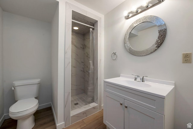 825 W Arapahoe Ave S, Salt Lake City, UT 84104 - full bath with wood finished floors, toilet, a stall shower, vanity, and baseboards