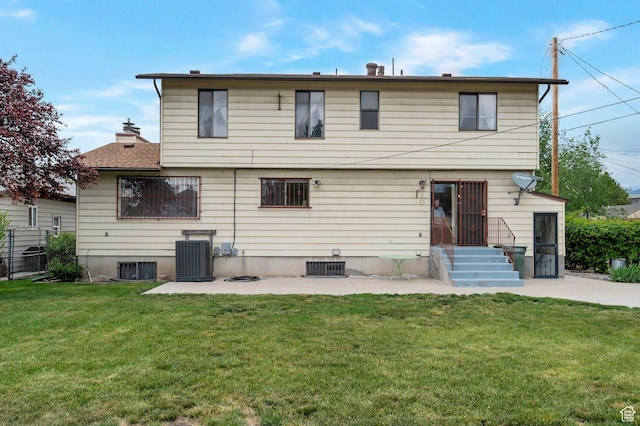 825 W Arapahoe Ave S, Salt Lake City, UT 84104 - rear view of house featuring a lawn, central AC unit, a patio area, and entry steps