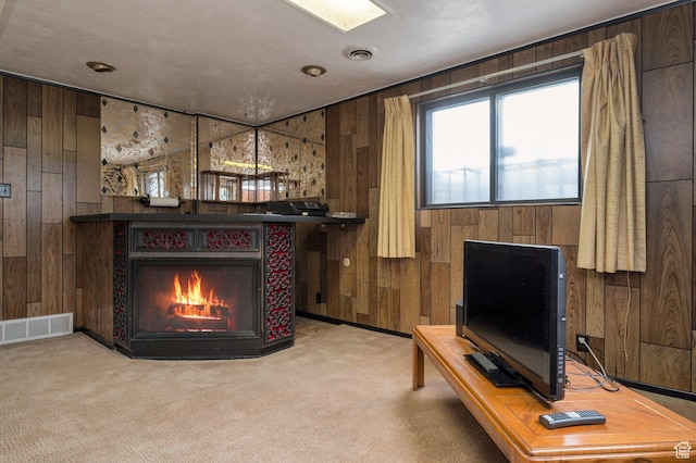 825 W Arapahoe Ave S, Salt Lake City, UT 84104 - sitting room featuring wood walls, carpet, and a lit fireplace