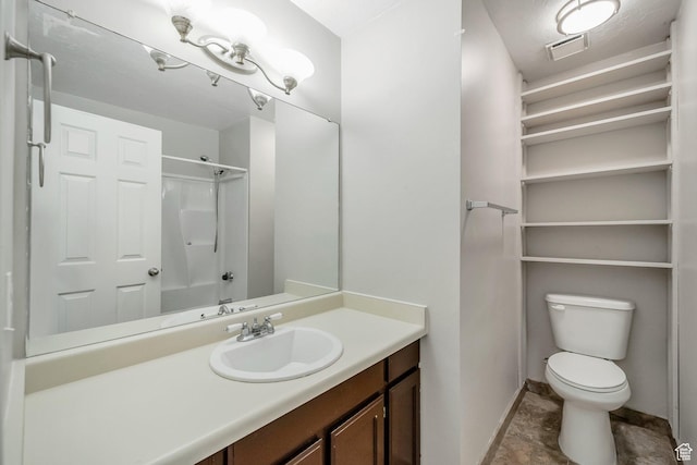 bathroom featuring baseboards, toilet, a shower, and vanity