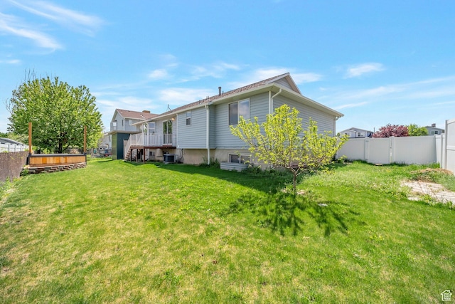 rear view of property featuring central AC