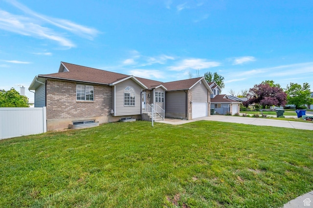 single story home featuring driveway, an attached garage, and brick siding