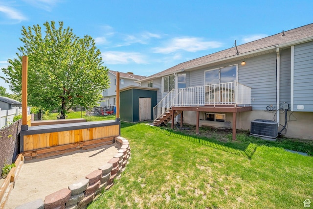 back of property with a storage shed, an outdoor structure, a deck, central air condition unit, and stairway