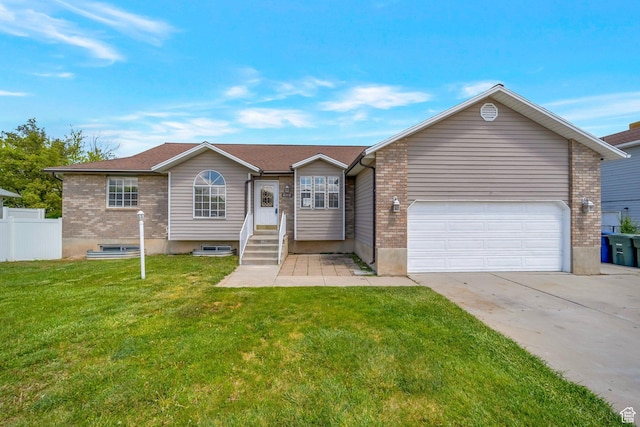 single story home with concrete driveway, an attached garage, and brick siding