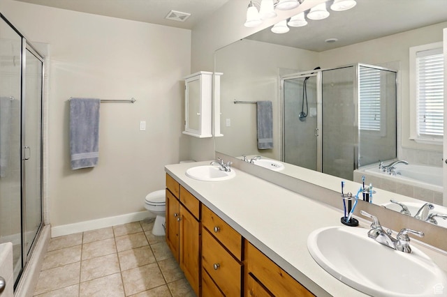 full bath featuring a shower stall, baseboards, tile patterned floors, toilet, and double vanity