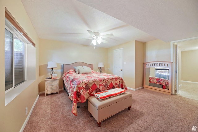 bedroom with carpet flooring, baseboards, and ceiling fan