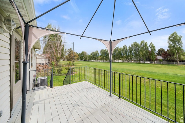 deck featuring a lawn and central air condition unit