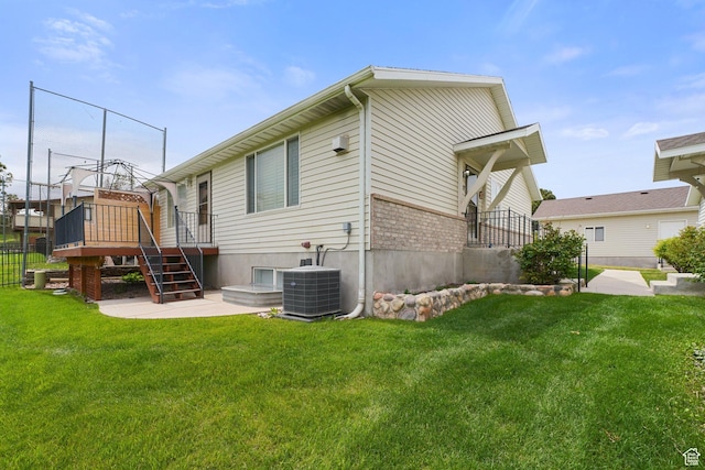 rear view of property with stairs, central air condition unit, and a wooden deck