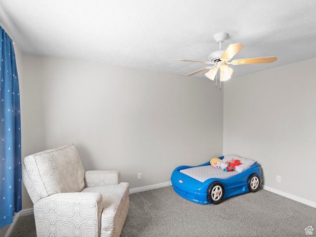 carpeted bedroom with baseboards and a ceiling fan