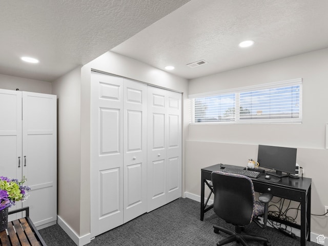 office featuring recessed lighting, a textured ceiling, dark carpet, and baseboards