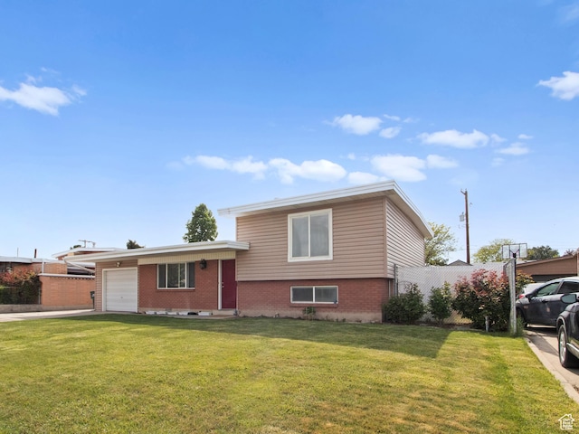 tri-level home with brick siding, a garage, and concrete driveway