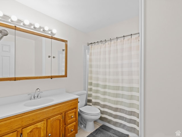 bathroom featuring toilet, vanity, tile patterned floors, and a shower with curtain