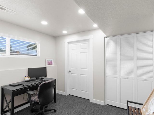 home office featuring dark carpet, recessed lighting, baseboards, and a textured ceiling