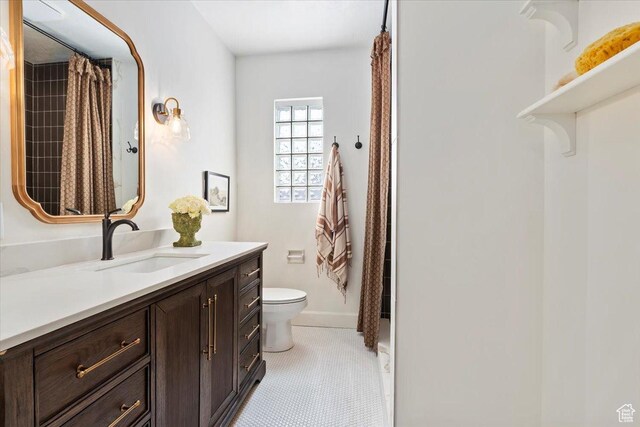 1920 E Westminster Ave, Salt Lake City, UT 84108 - bathroom featuring toilet, vanity, and a shower with shower curtain