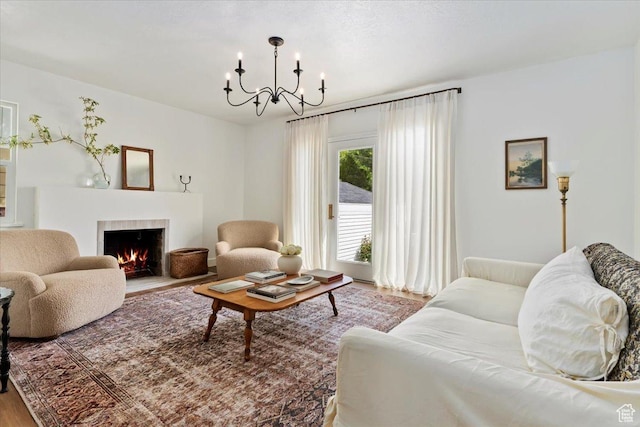 1920 E Westminster Ave, Salt Lake City, UT 84108 - living room with a chandelier, wood finished floors, and a tile fireplace