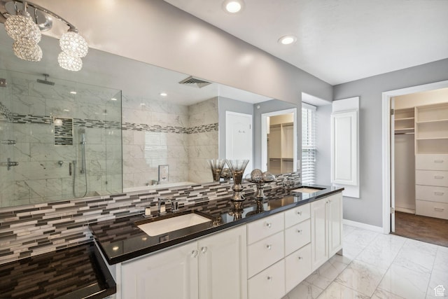 2863 S Cove Ln, Bountiful, UT 84010 - bathroom featuring a shower stall, baseboards, marble look tiles, backsplash, and double vanity