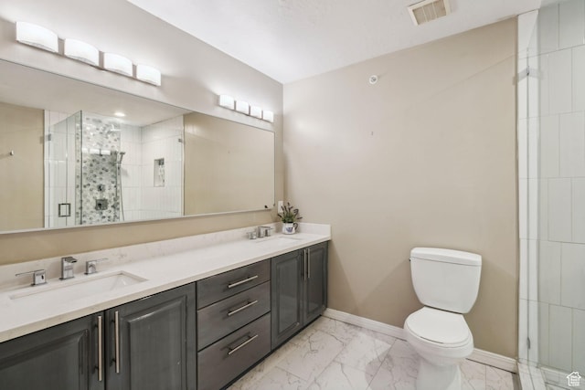 2863 S Cove Ln, Bountiful, UT 84010 - full bath featuring marble finish flooring, toilet, a stall shower, baseboards, and double vanity